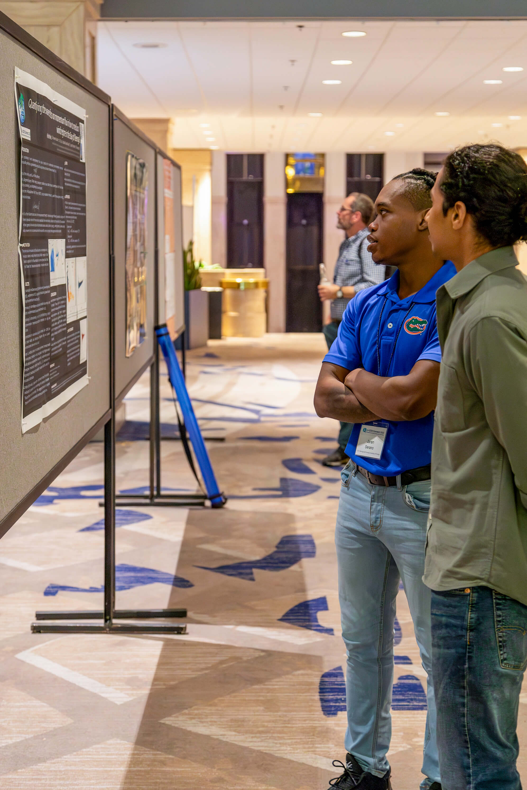 Attendees discussing posters during poster session at LI-COR Connect 2023